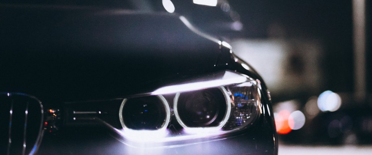 Front car lights at night on the road